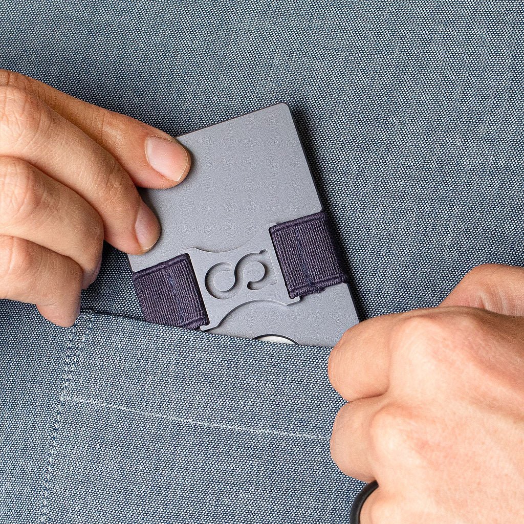 a person holding a cell phone in their hands